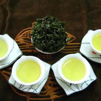 What are the effects, functions, and contraindications of Tieguanyin?