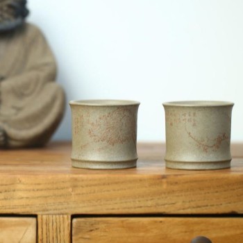 What type of host cup complements a purple clay teapot?