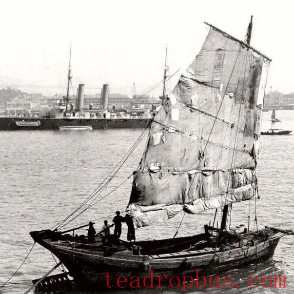 In 1902, Hong Kong. A cargo ship is seen ready to depart in the distance.