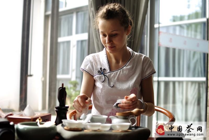 Beautiful woman performing tea ceremony
